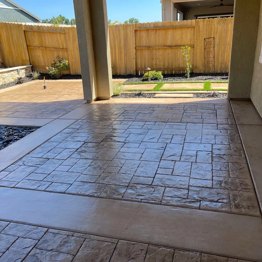 Paver patio under a covered porch beside the house