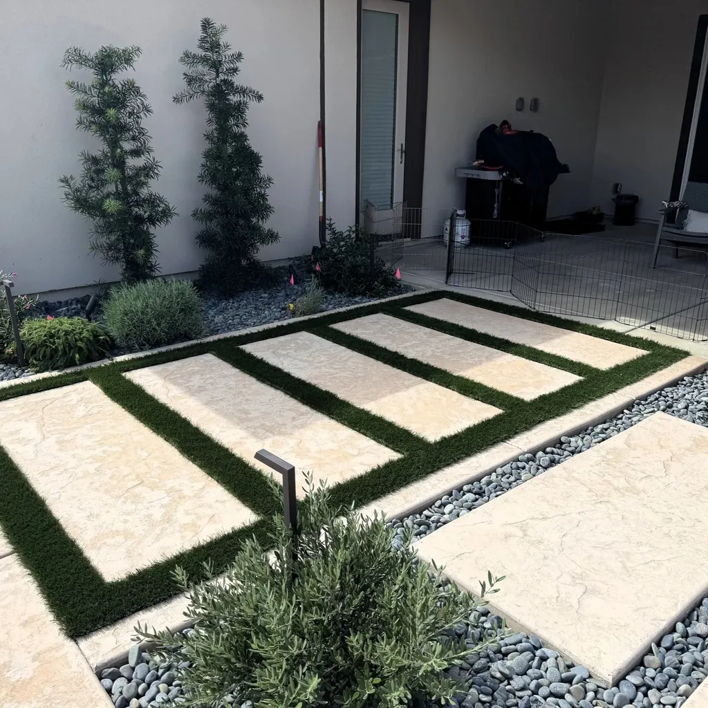 Large concrete steppers with turf joints beside a modern home