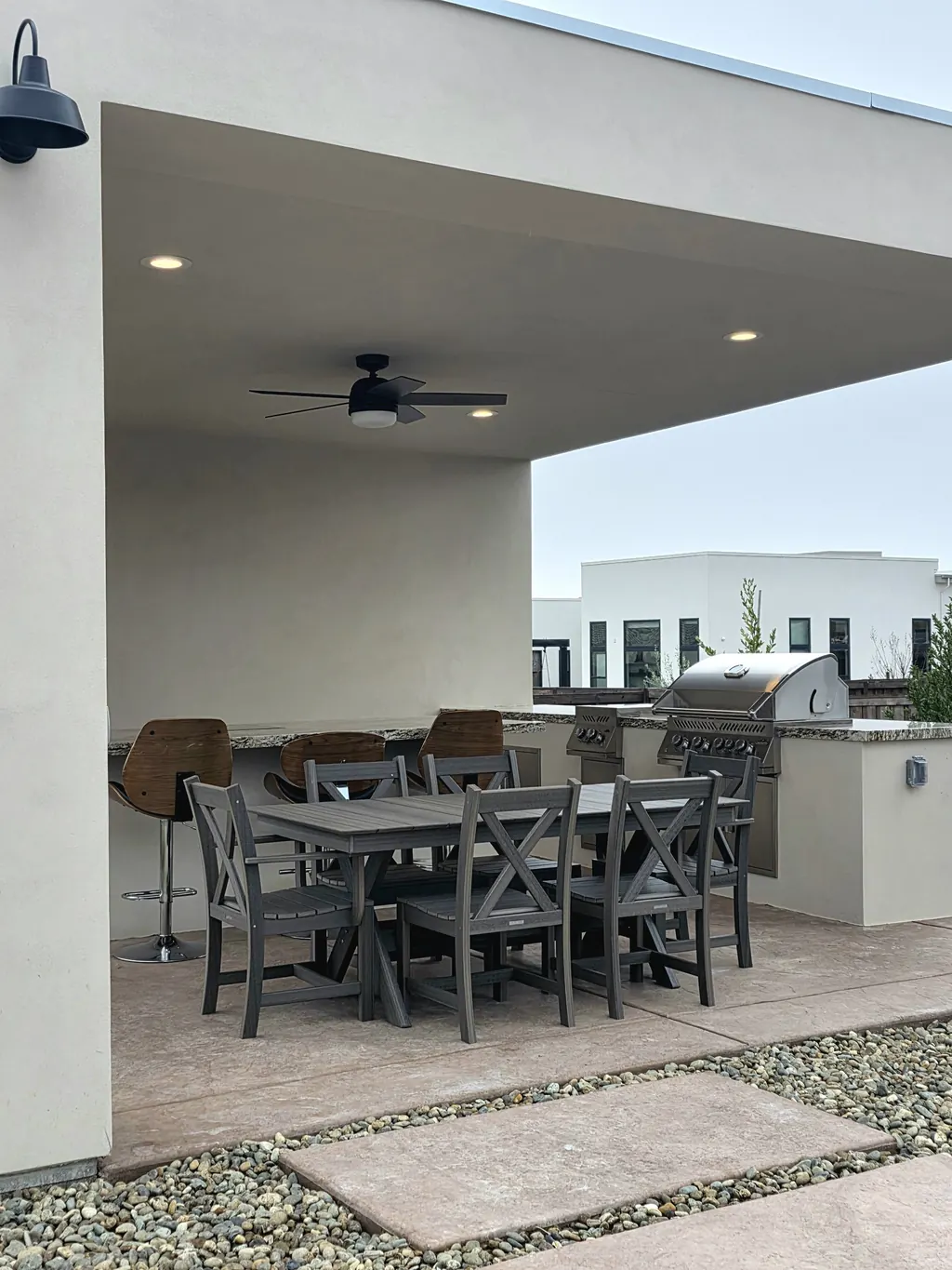Covered patio with outdoor kitchen and dining table